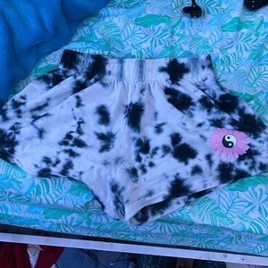 tie dye shorts with flower and ying yang decal